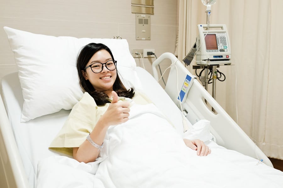 Asian Patient Girl Thumbs Up Ok Sign And Smile While Resting On Hospital Regional One Health